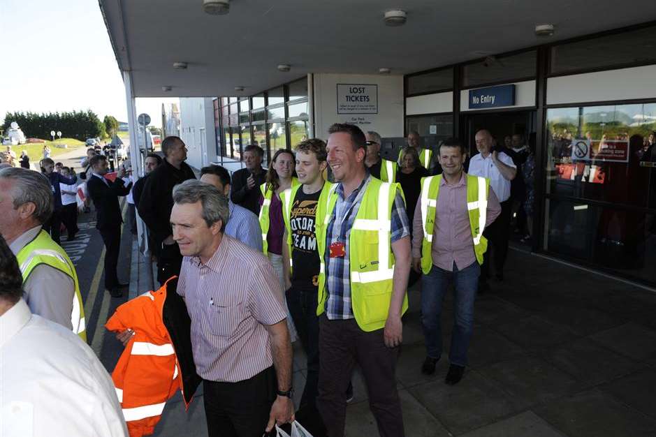 Workers leave the terminal building for the last time. Picture: Tony Flashman