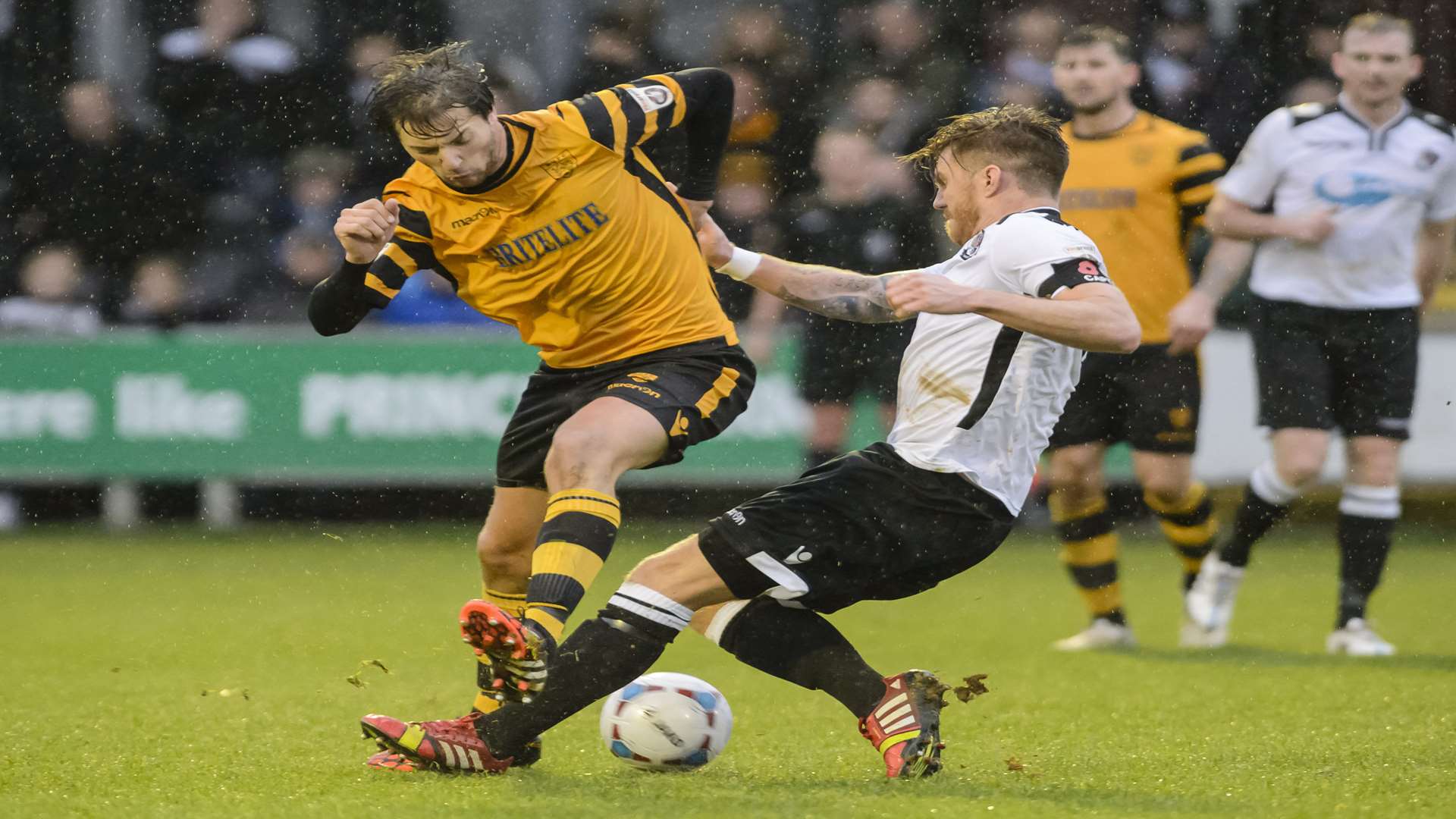 Dartford captain Elliot Bradbrook tackles Maidstone's Joe Healy Picture: Andy Payton