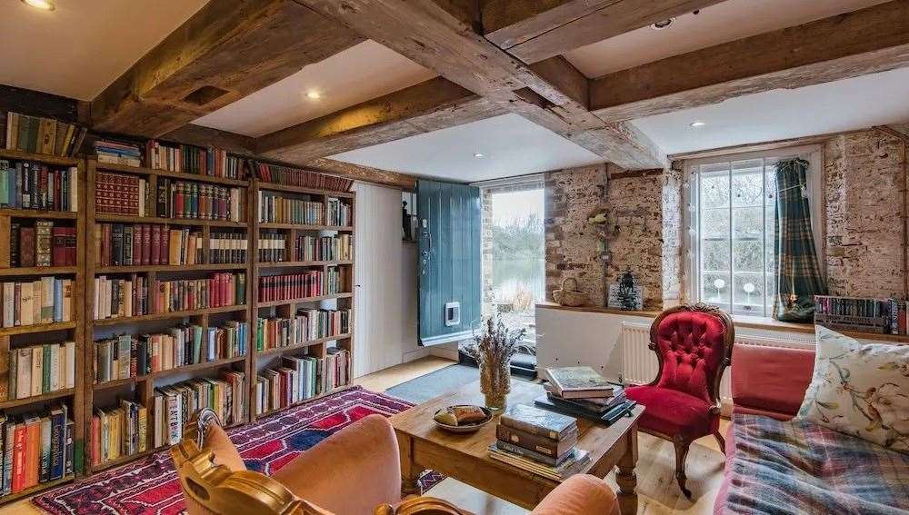 The library is one of the few rooms in the house that still has some of the mill's original features. Picture: Unique Property Company