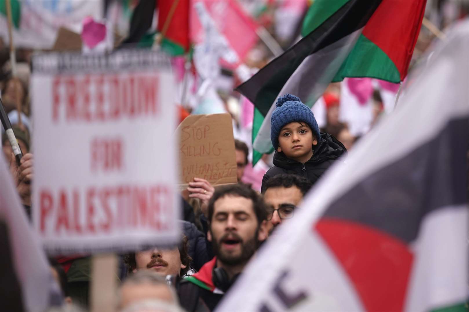 People with Palestinian flags in Dublin city centre during a pro-Palestine march (Brian Lawless/PA)