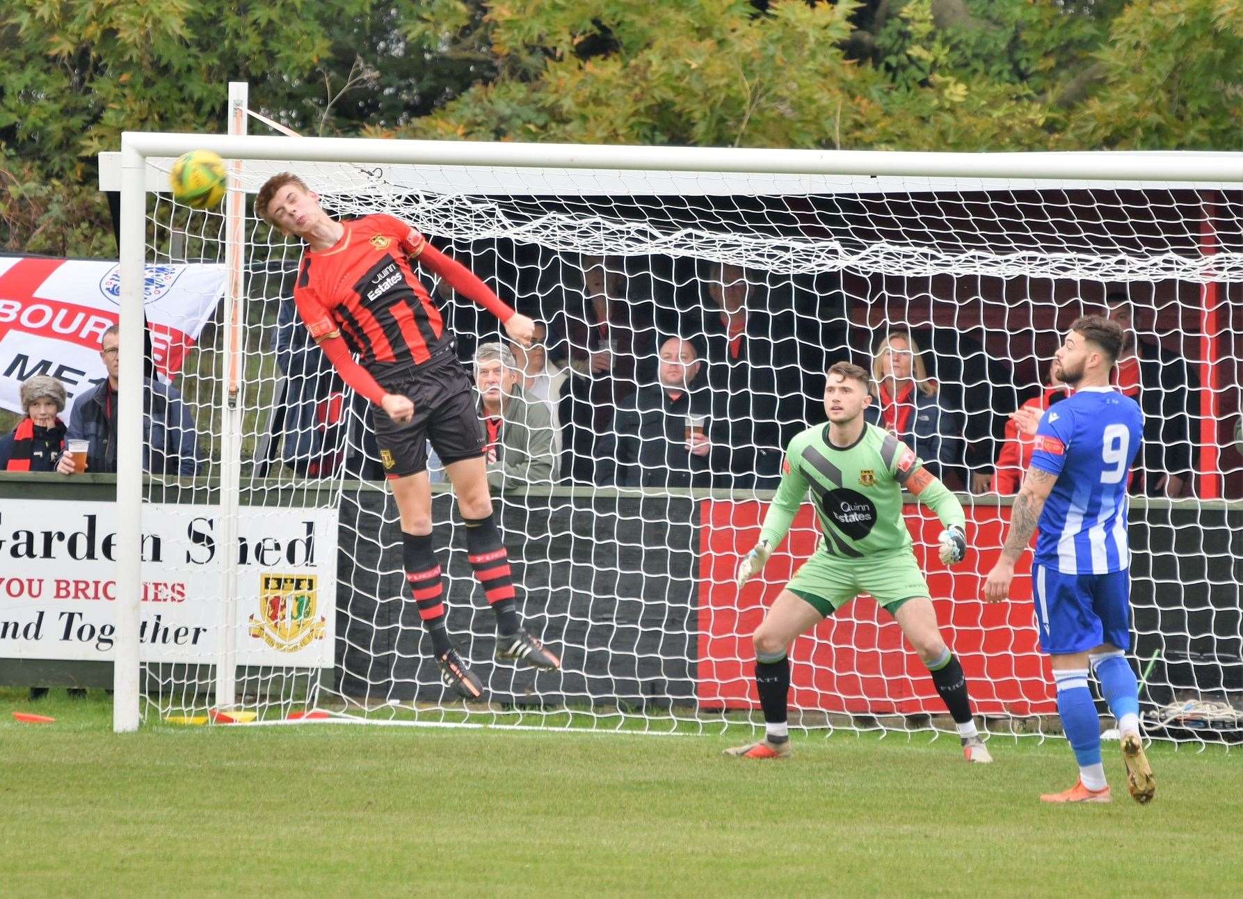 Last-ditch defending by Lex Allan denies East Grinstead on his final Sittingbourne appearance Picture: Ken Medwyn