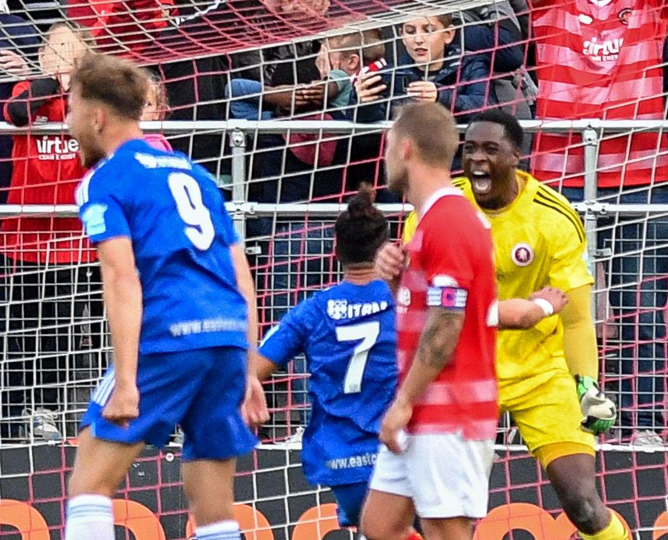 Welling celebrate keeper Kai McKenzie-Lyle's last-gasp penalty save. Picture: Dave Budden