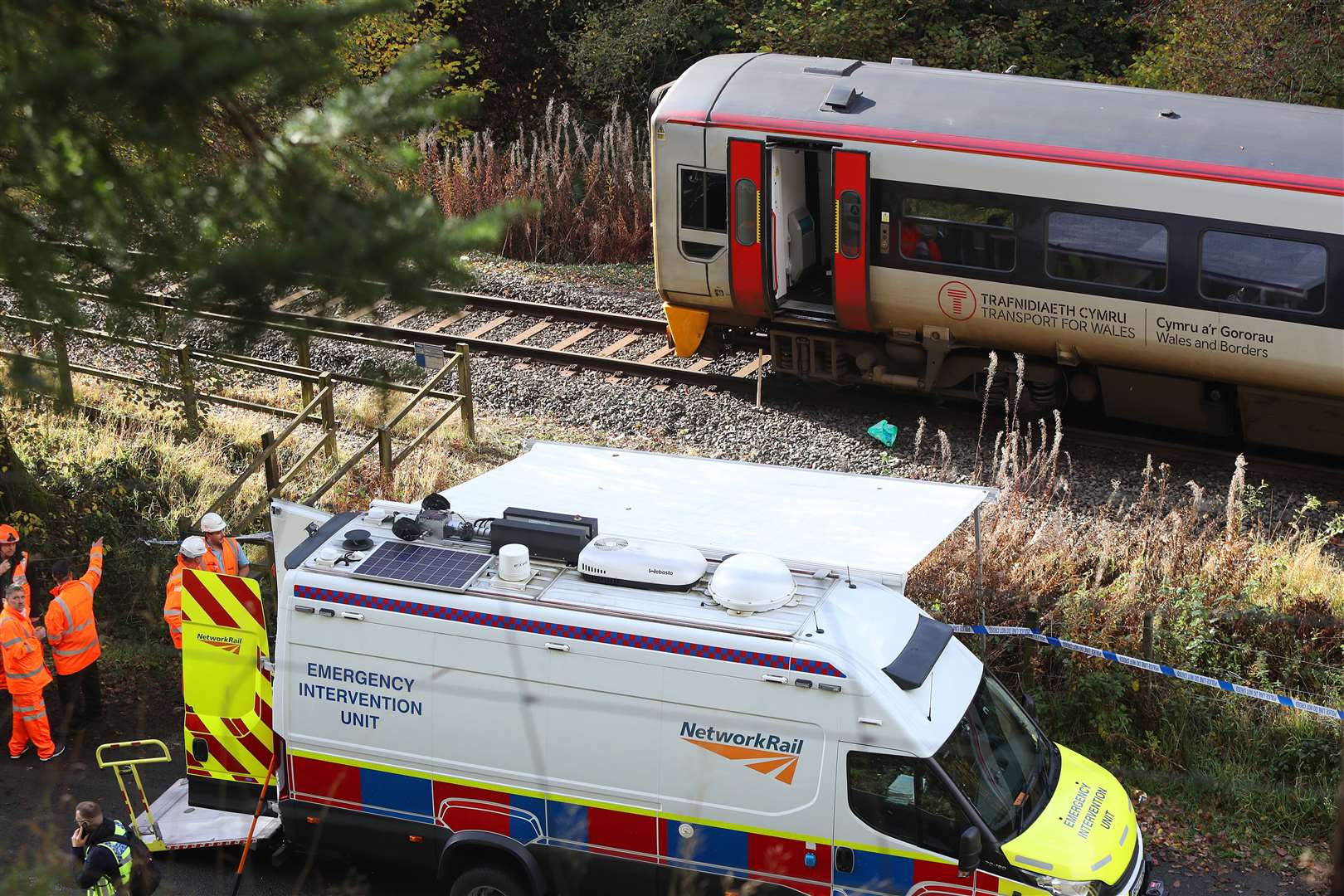 Emergency workers at the scene after the collision involving two trains (Ian Cooper/PA)