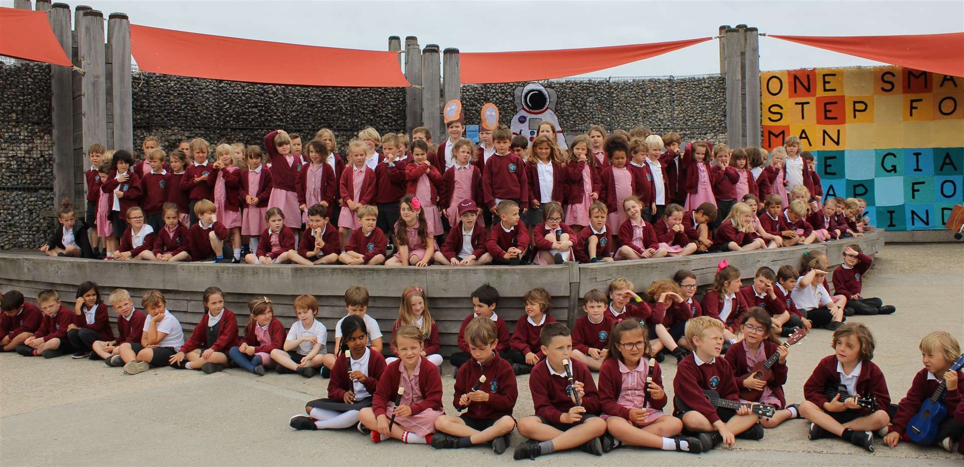 The pupils from Westmeads take the stage at Dead man’s Corner to sing one of their songs about saving the environment. Pic: Kent County Council