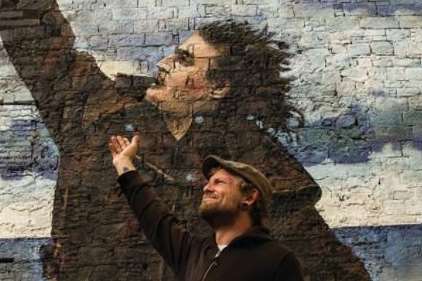 John with the mural of Billy Connolly in Glasgow