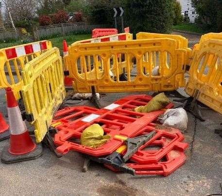 Plastic fencing was previously placed over the hole