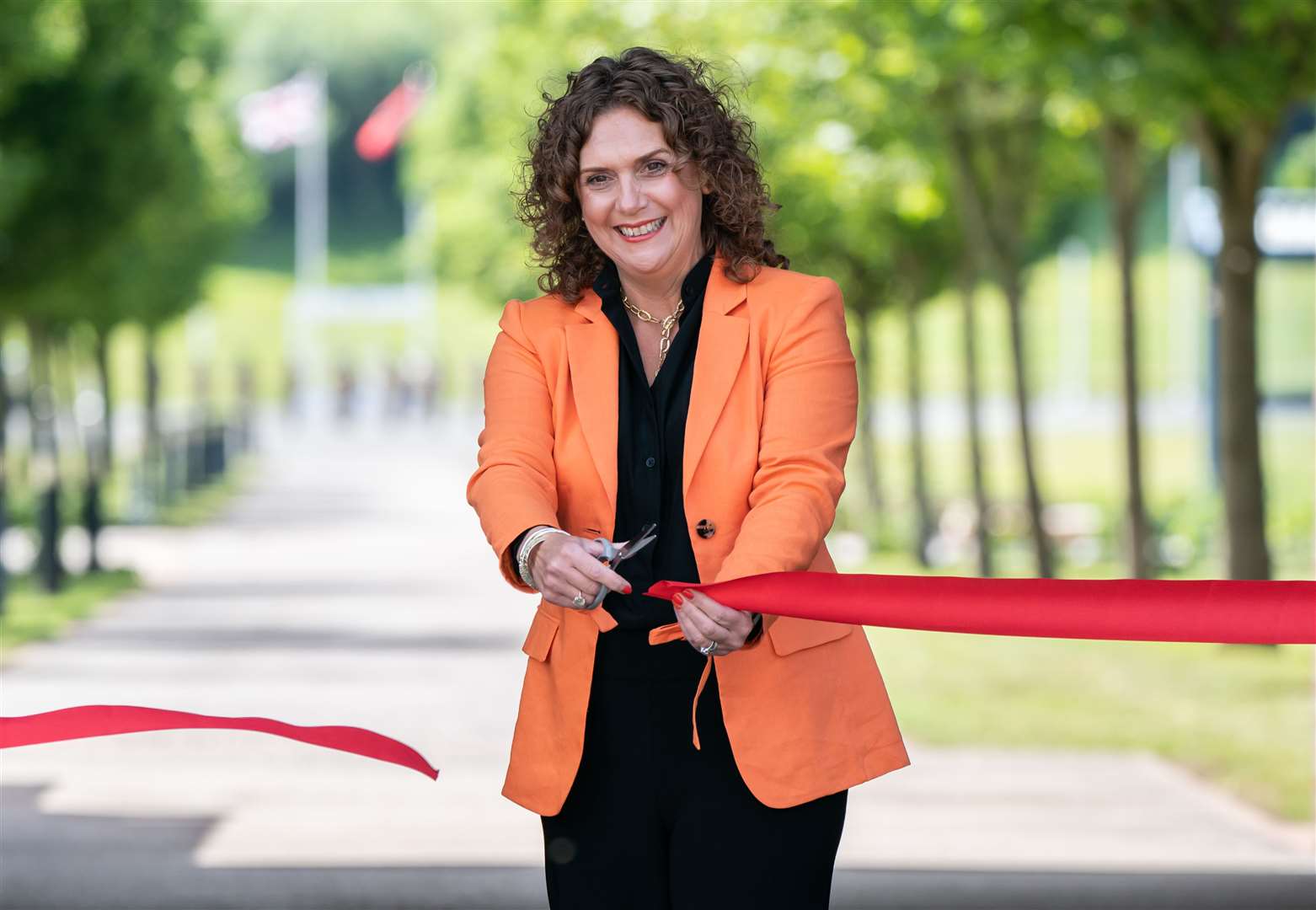 Hannah Ingram-Moore, daughter of Captain Sir Tom Moore, cuts a ribbon to officially open a walkway dedicated to her late father at the Army Foundation College in Harrogate (PA)