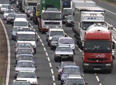 Traffic on the M20. Stock image.