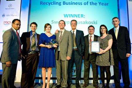 SWEEEP Kuusakoski collects its award for Recycling Business of the Year. From left: Krishnan Guru-Murthy; Justin Greenaway, Vanessa Hewitt, Mike Marais, Patrick Watts,Rob Smith, all SWEEP; Rebecca Woods of sponsor Prova PR; and Steve Eminton, editor, letsrecycle.com.