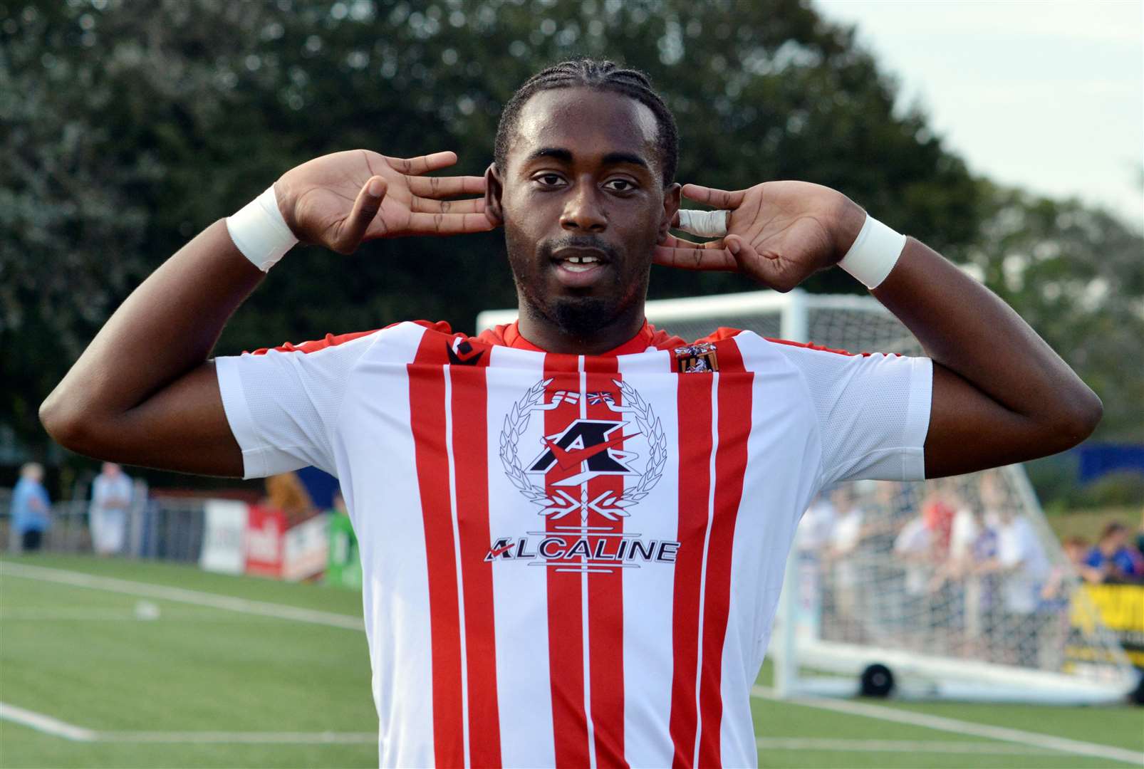 Folkestone forward Ira Jackson celebrates his goal at Margate. Picture Randolph File