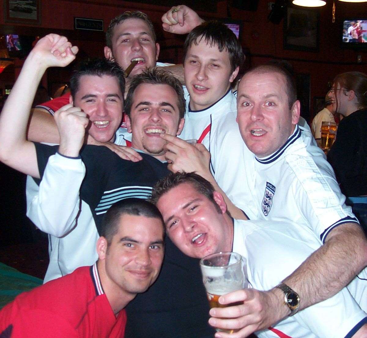 Fans in the Railway Hotel, Dartford, celebrating after England's 3-0 win over Denmark in the 2002 World Cup