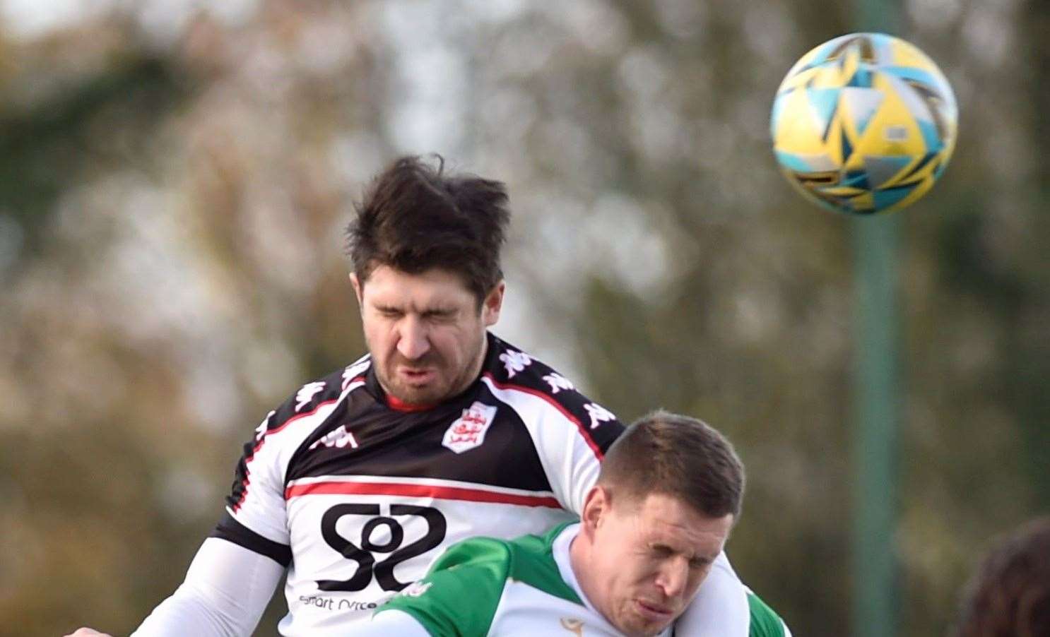 Faversham defender Matt Newman wins a header. Picture: Ian Scammell