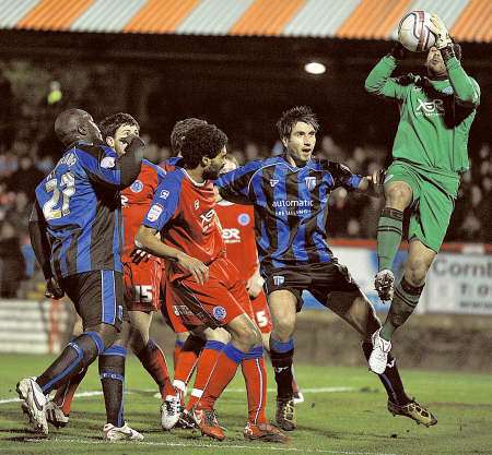 Aldershot goalkeeper Jamie Young denies Garry Richards