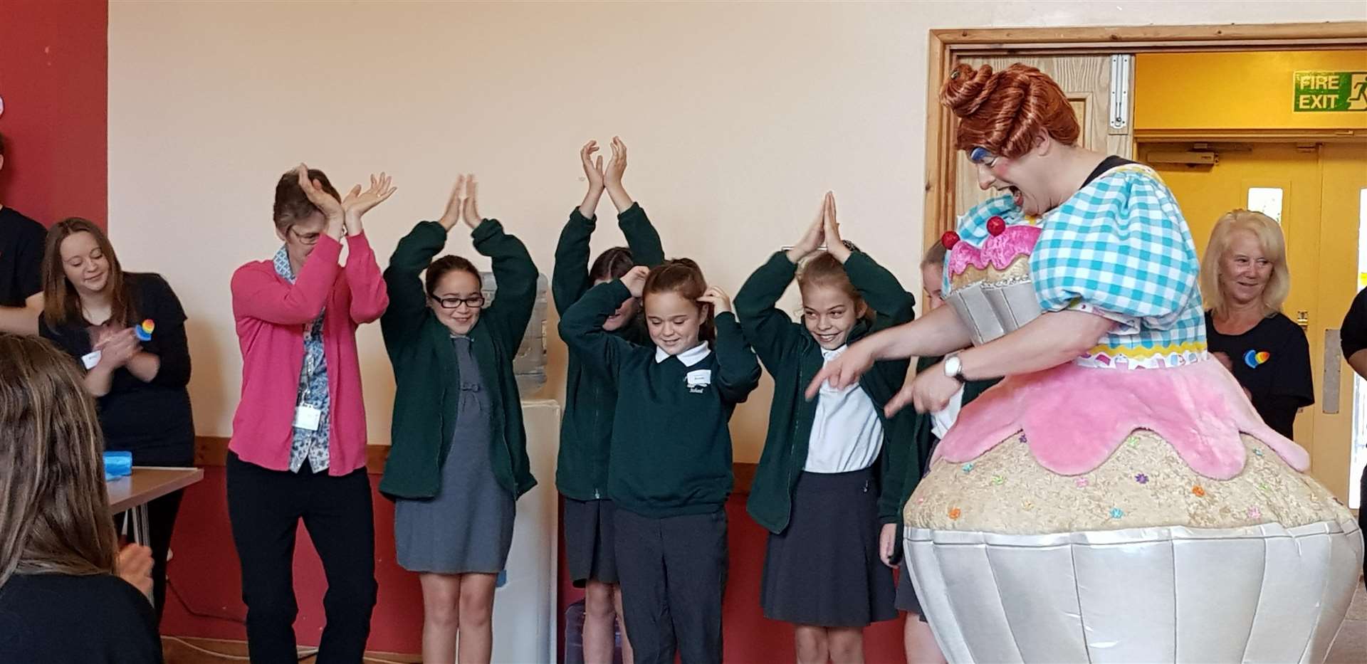 Children contorting to symbolise healthy foodstuffs, with Ben Roddy. Picture: Tilmanstone Salads