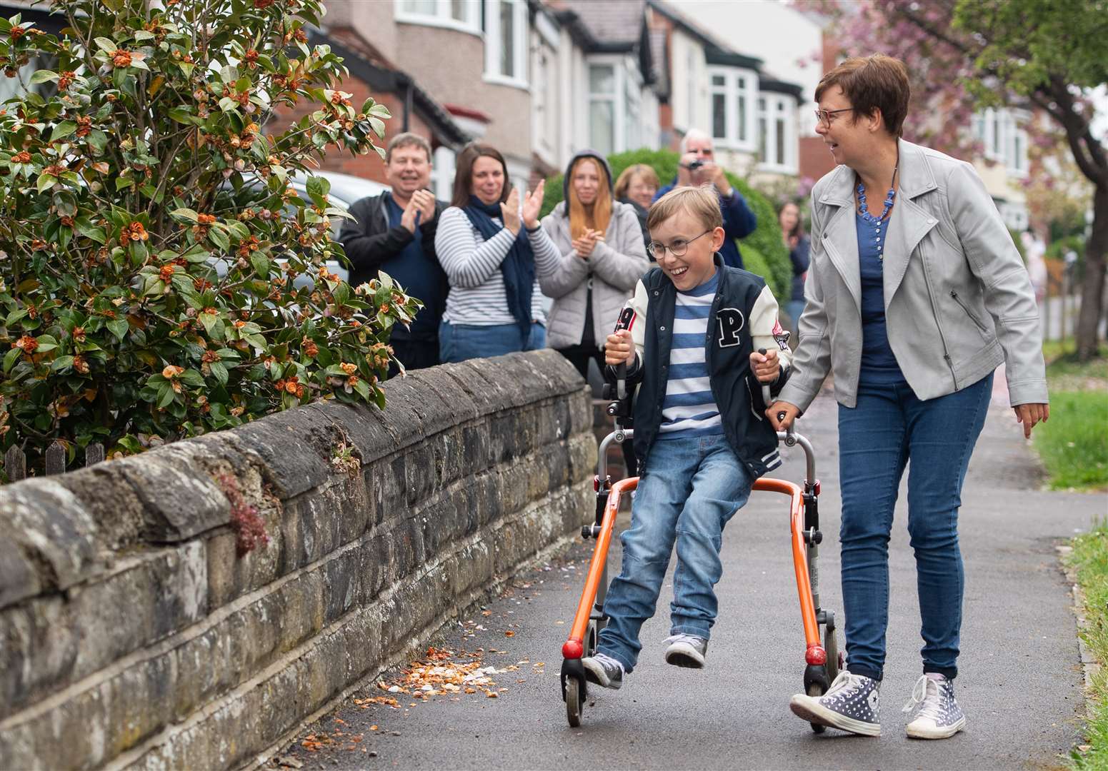 Tobias is cheered by neighbours in Sheffield (Joe Giddens/PA)