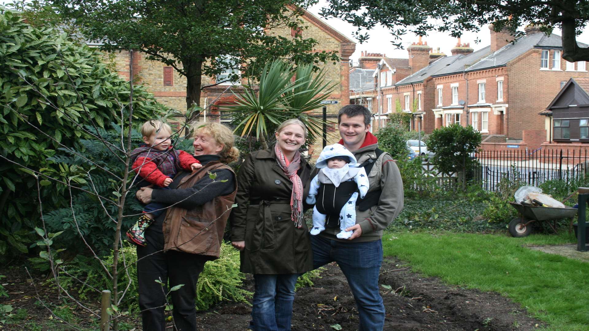 A family enjoys the memorial garden.