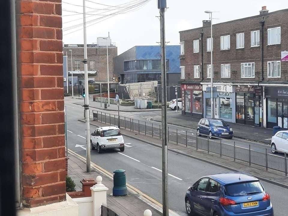 Fencing around the demolished former fire station in Watling Street, Chatham has sent debris flying down the road. Picture: Nicole Fox