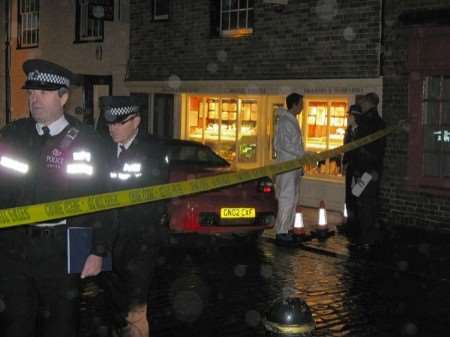 Michael Stilwell's shop in the Burgate shortly after Monday's armed robbery