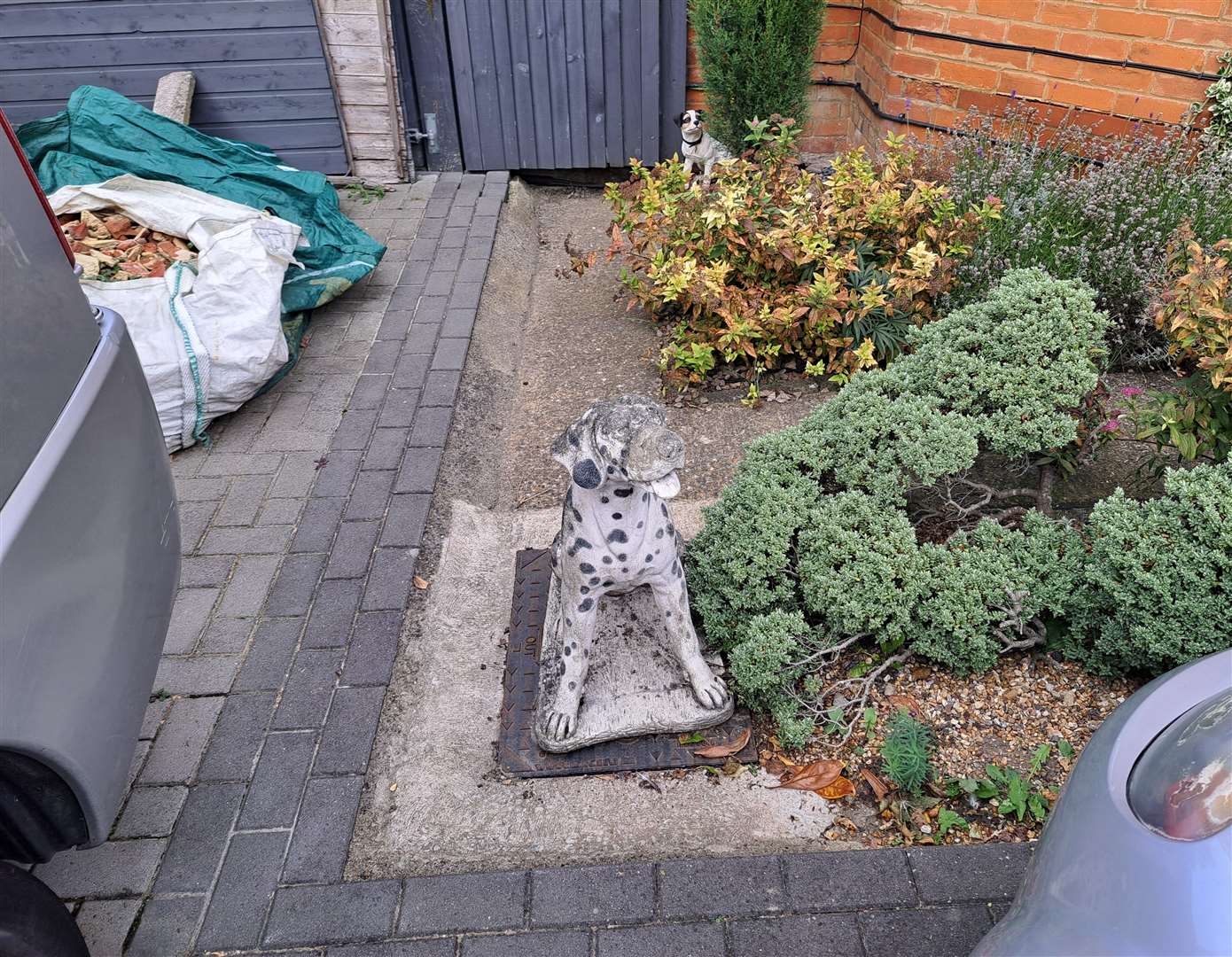 Mick Goodrich has tried holding the drain cover down with a large concrete dog ornament- but it still lifts