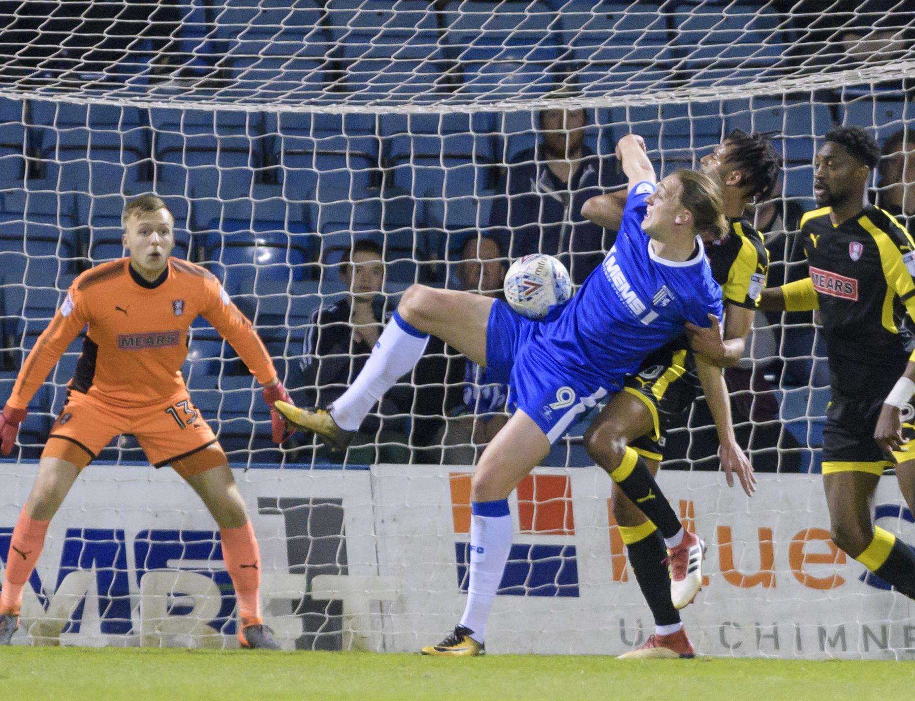 Tom Eaves surrounded as he tries to win the ball Picture: Andy Payton