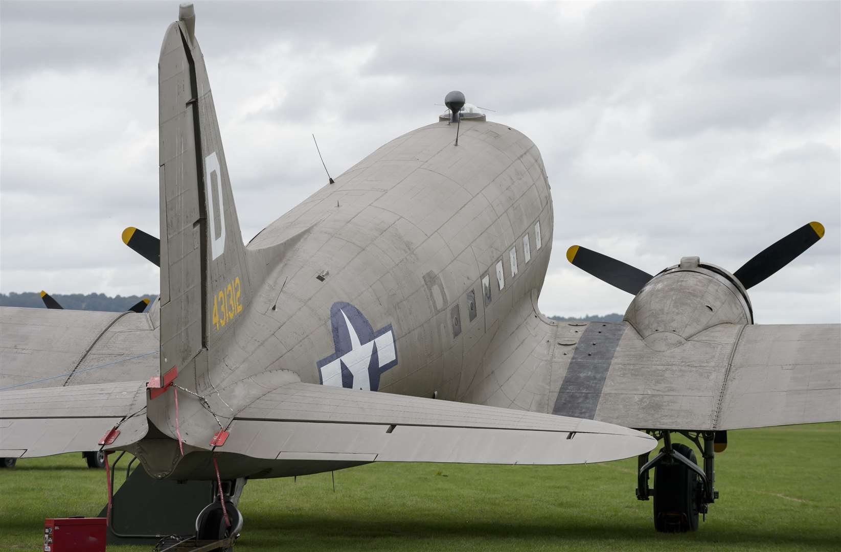 A Douglas C47 Skytrain parked on the airfield