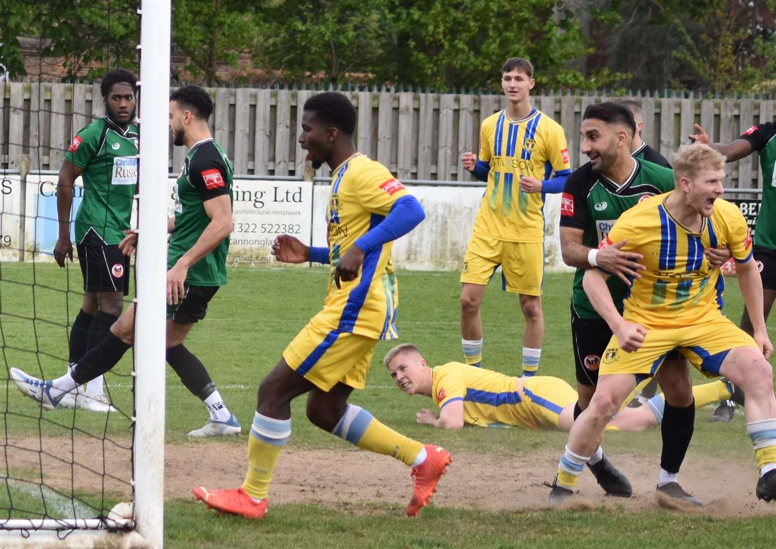 Joe Tyrie (grounded) scores Sittingbourne's second at Phoenix. Picture: Alan Coomes