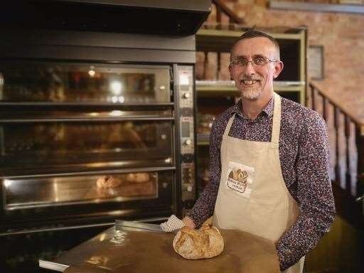 The Rev John Western serving up his bakes