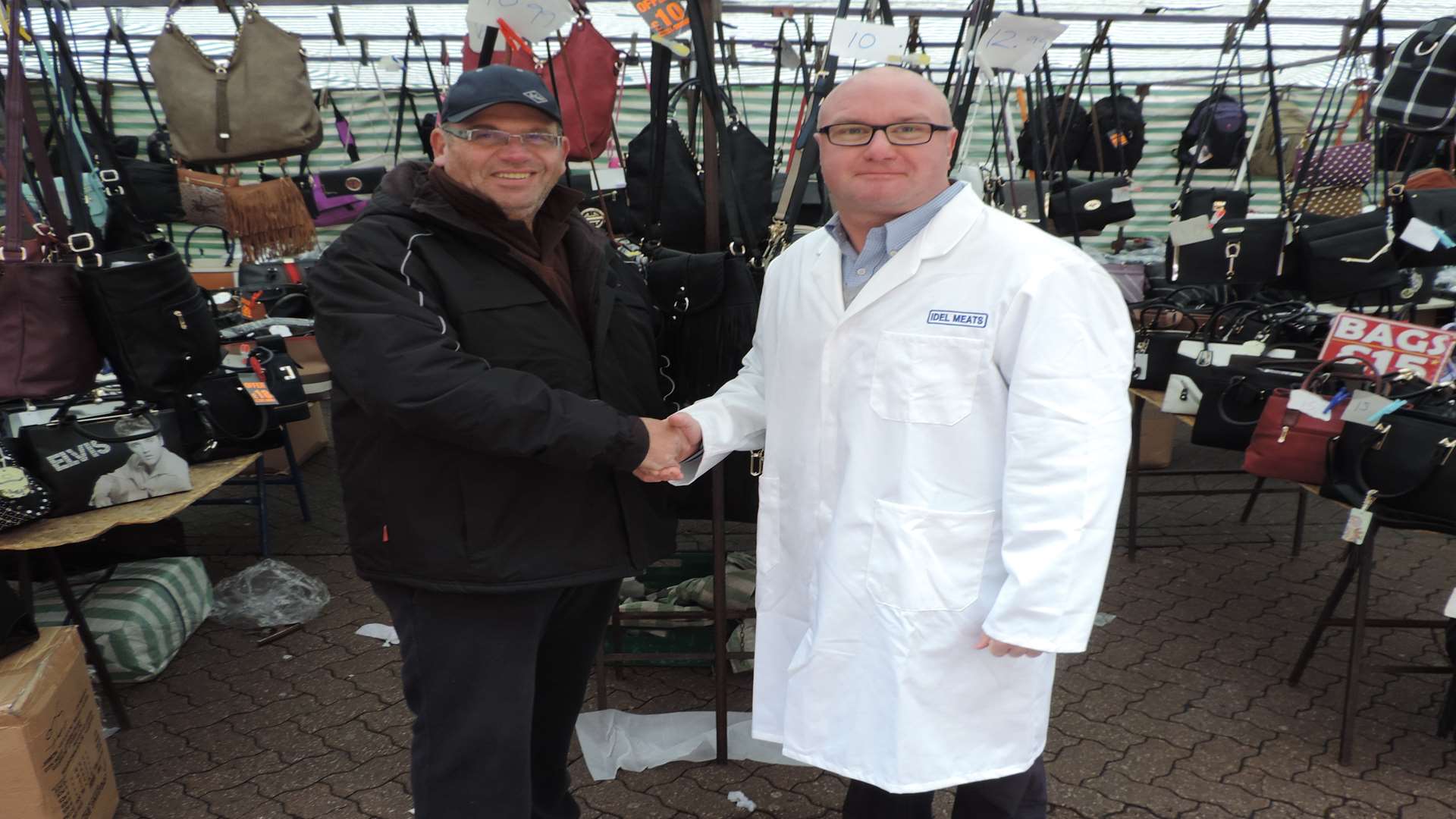 Simon Zaiden, who sells bags, suitcases and purses and Chas Bassett, owner of Idel Butchers, at Dartford Market.