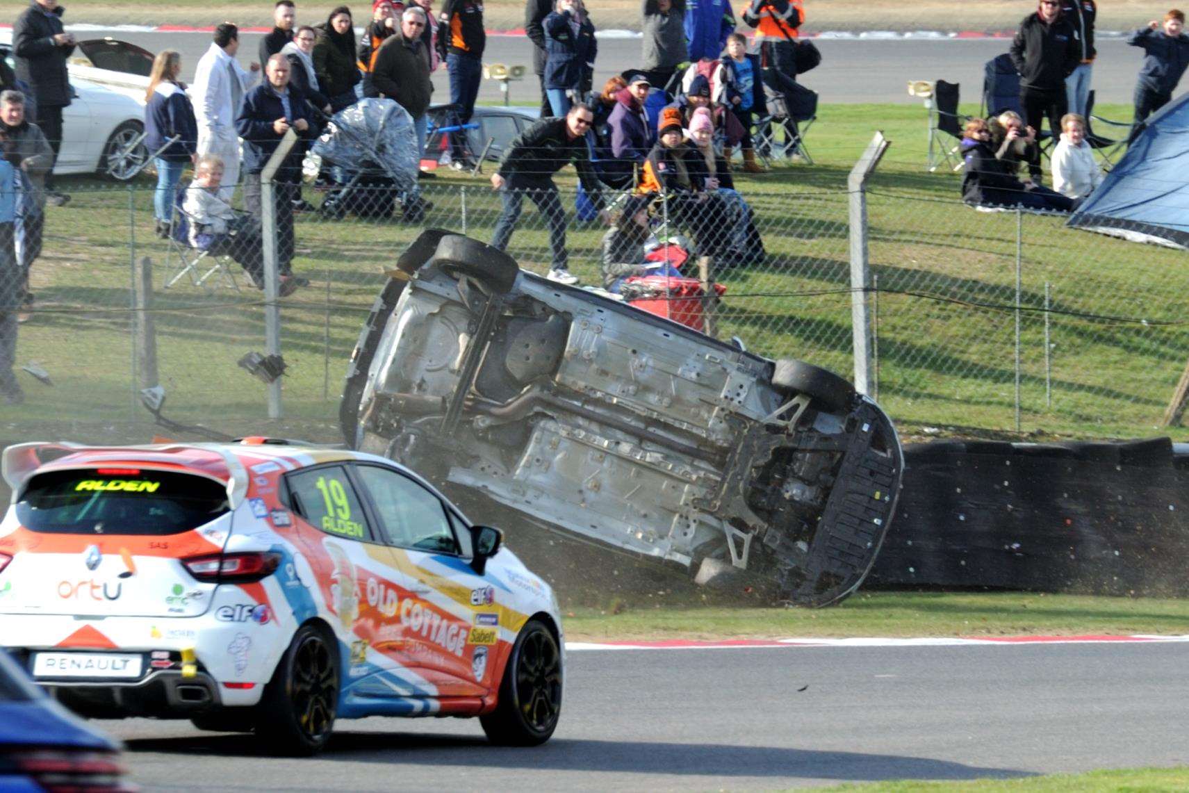 Brett Lidsey, from Northfleet, rolled on the first lap of the Renault Clio Cup race. Picture: Simon Hildrew