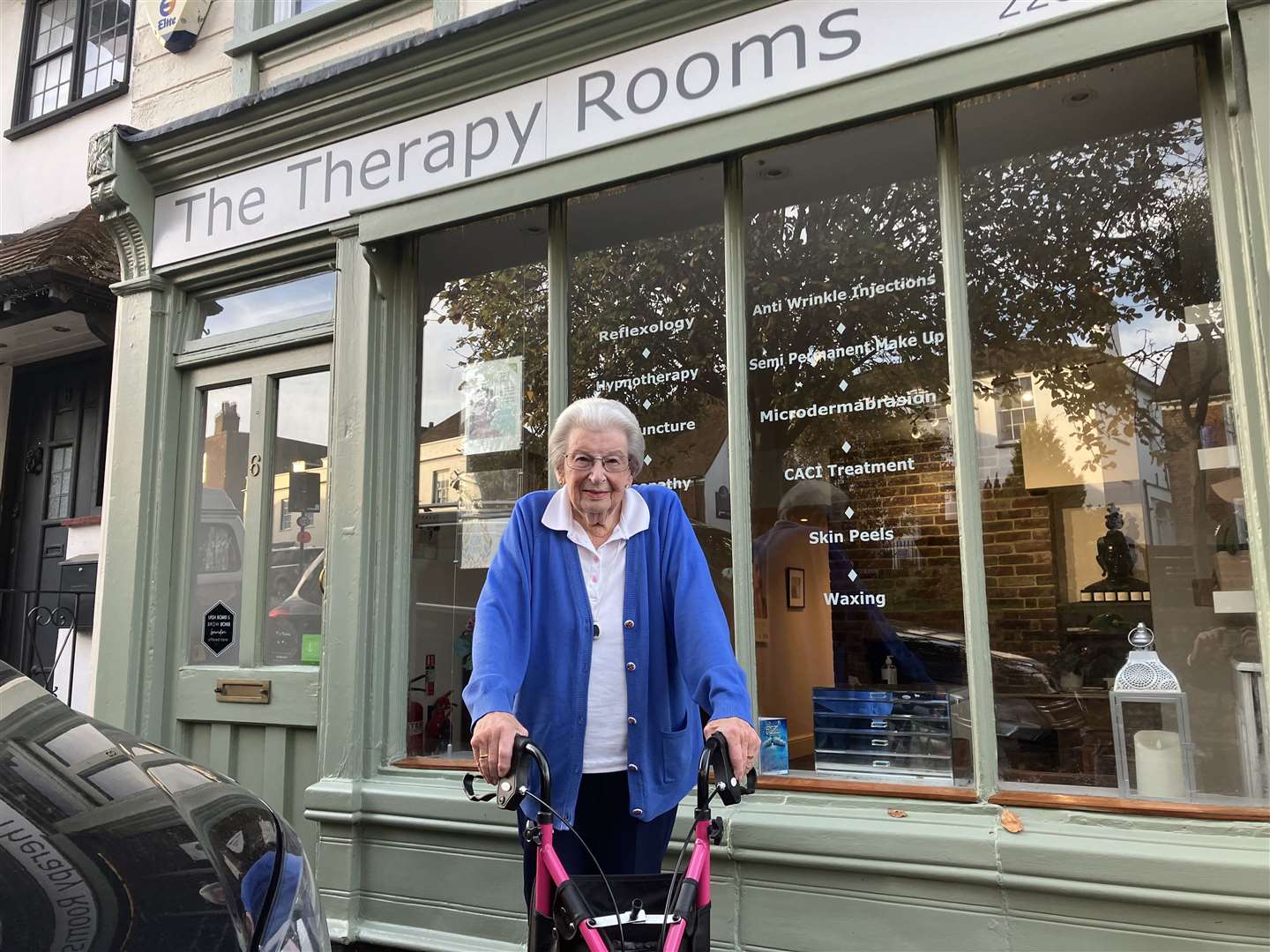 June Briggs outside the old A L Briggs general stores, now The Therapy Rooms, in 2022.