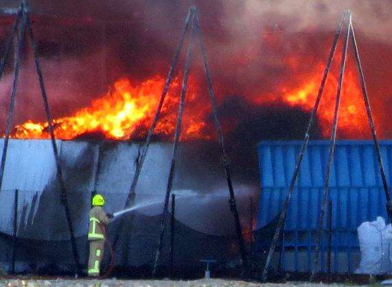 A firefighter tackles the blaze. Picture: MrG