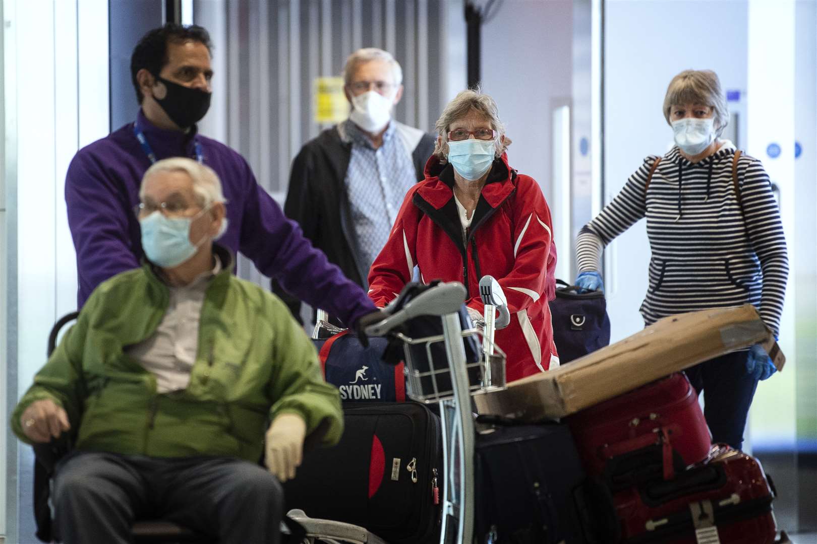 Passengers from the Holland America Line ship Zaandam were flown back to London from the US (PA)