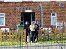 The scene at Noreen Avenue with armed police taking Beckett away