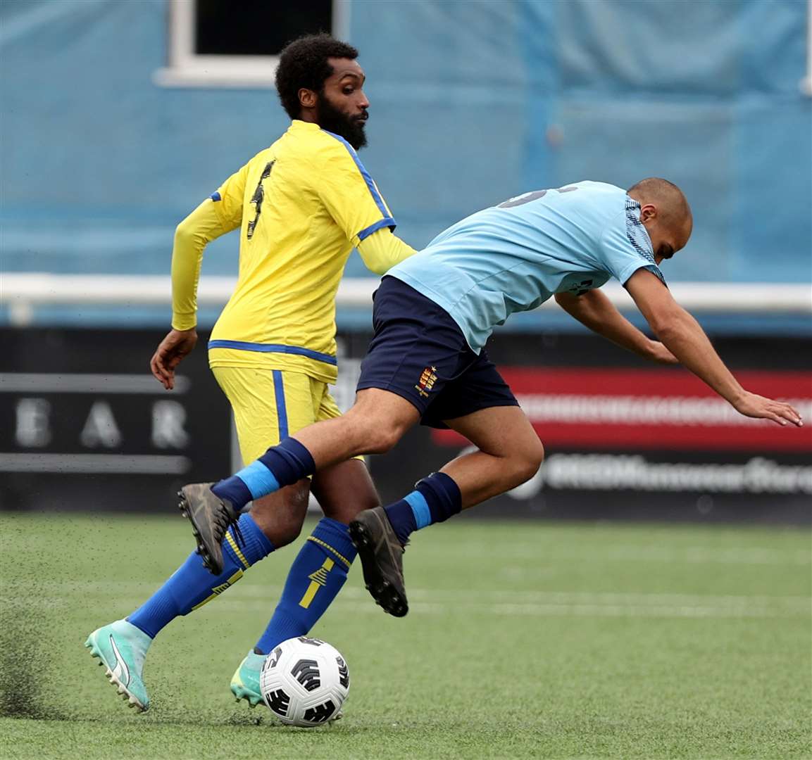 Dover Rangers player Reece Brandy is sent to ground by Streatham defender Jamal Farid. Picture: PSP Images