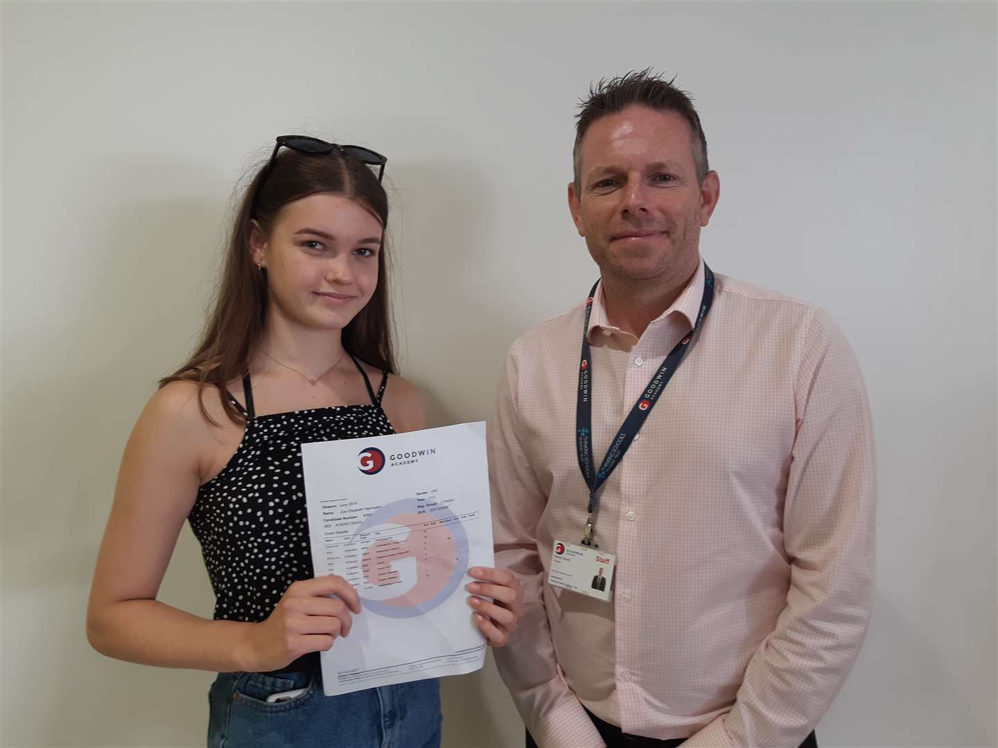 Zoe Harrington is congratulated by Goodwin Academy principal Simon Smith