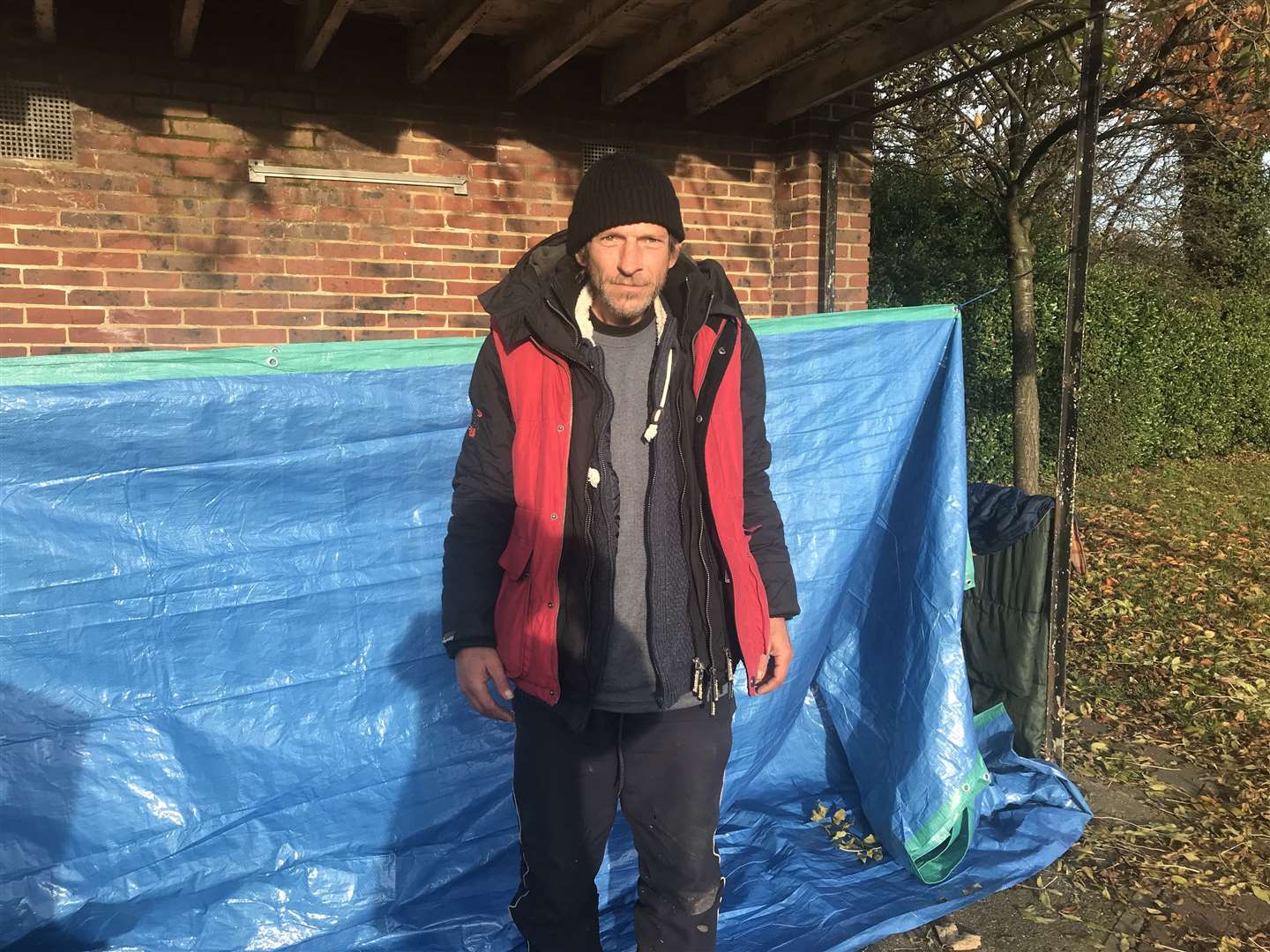 Jim outside his bus shelter digs. Picture by Roger Vaughn