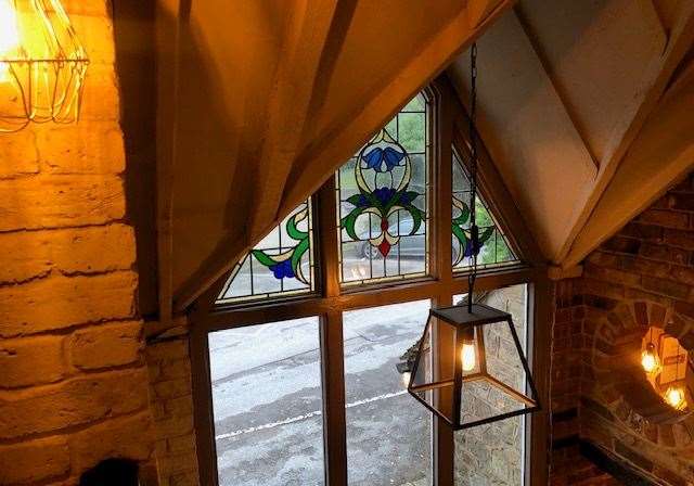 This side of the Old Rectory has been redeveloped more recently than the rest of the building but the colourful windows have been carefully matched to others in the pub