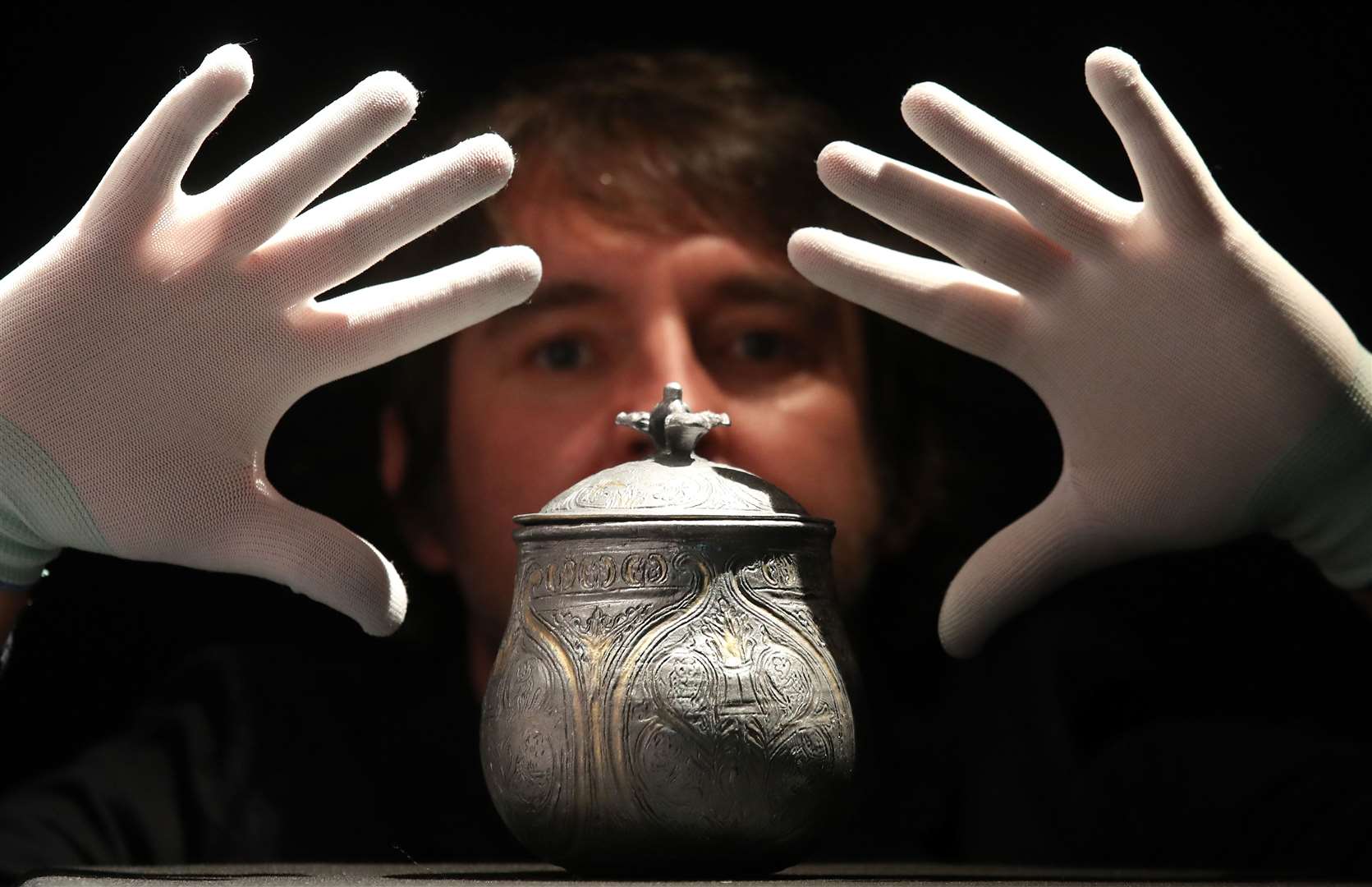 Curator Martin Goldberg with a 3D reconstruction of a lidded vessel found as part of the Galloway Hoard (Andrew Milligan/PA)