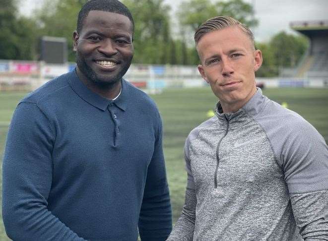 Maidstone United manager George Elokobi shakes on the new deal with Sam Corne. Picture: MUFC