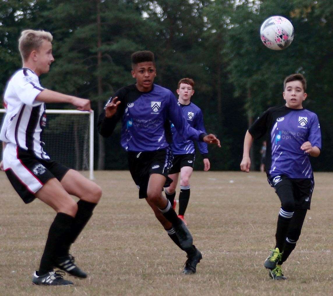 Anchorians United (purple/black) outnumber Milton & Fulston United during their Under-16 League Cup tie Picture: Phil Lee