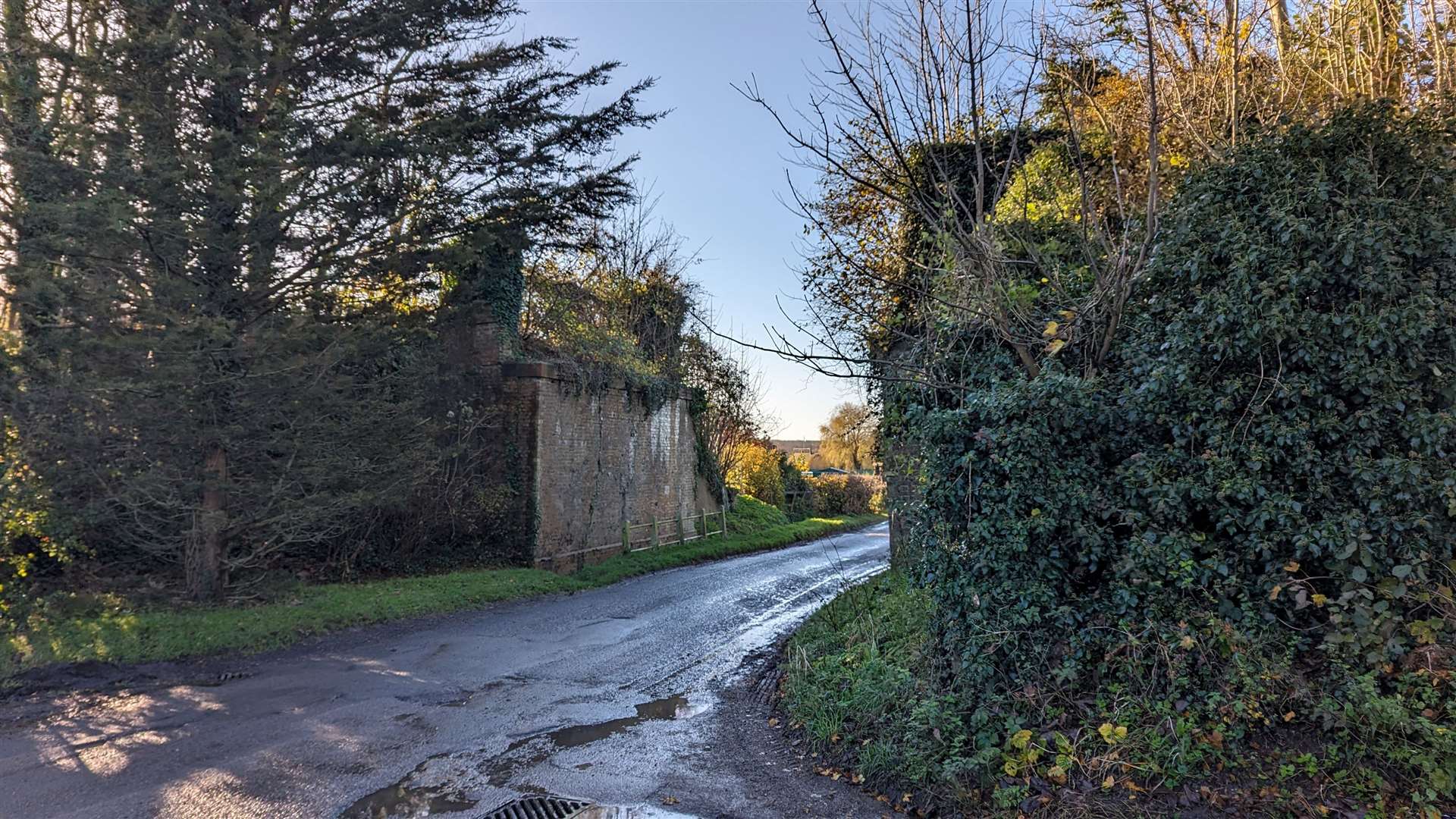 The remains of a former railway bridge over the road out of Newington