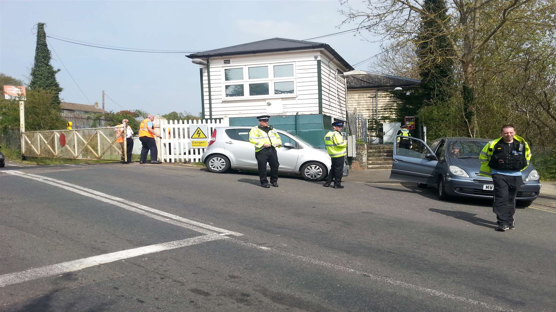 A Network Rail employee has been taken to hospital after the gate he was operating was hit by a vehicle