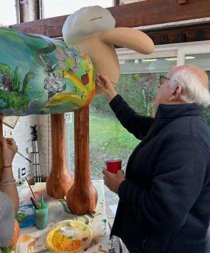 Ralph Steadman painting the designs on the Sheep-nanigans statue