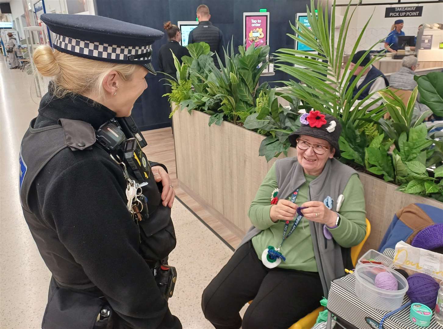 PC Honess chats with retiree Patricia in Tesco Superstore