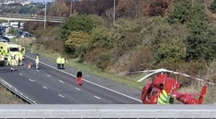 The air ambulance lands and traffic is held on the A2 after the crash. Picture: Caroline Smileey