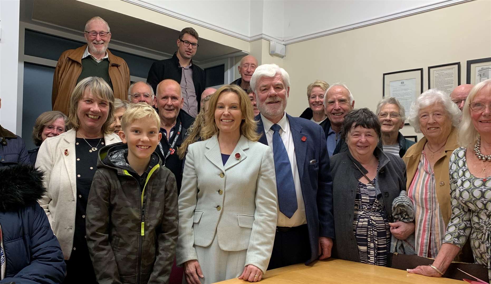 Natalie Elphicke, with members of the Dover and Deal Conservative Party, is expected to win the seat her husband held since 2010