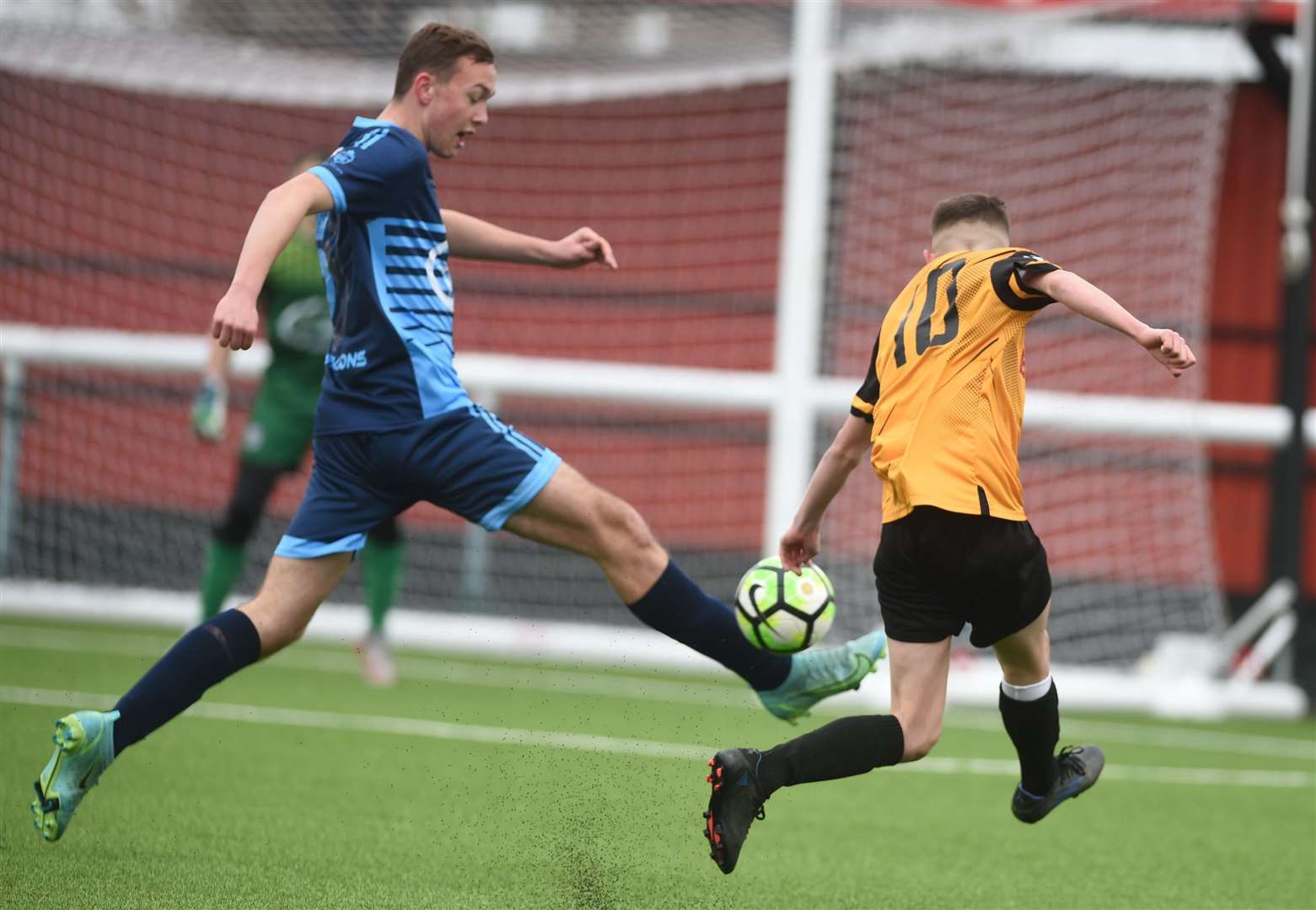 An early Maidstone under-14s shot is blocked by Rochester City under-14s (blue). Picture: PSP Images