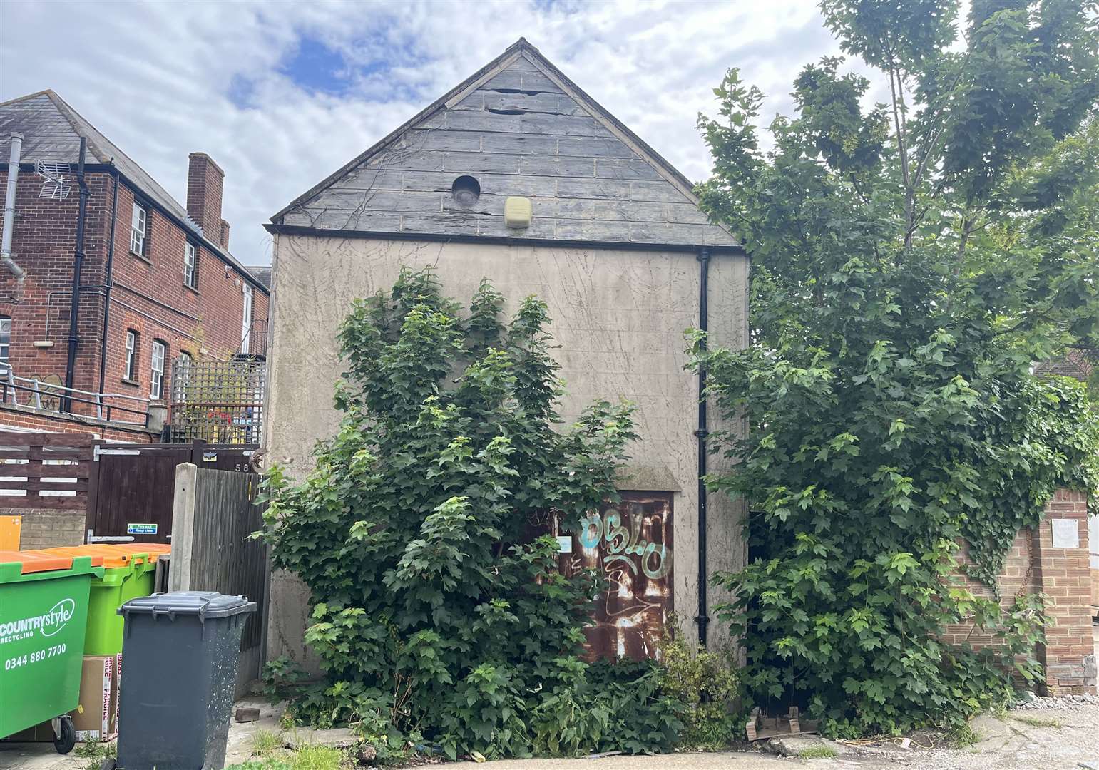 The old warehouse to the rear of the site on Whitstable High Street is set to be demolished as part of the three-flat proposal