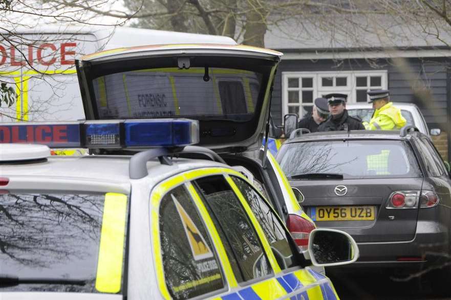 Police officers in Satmar Lane, where Michael Kerr was found dead