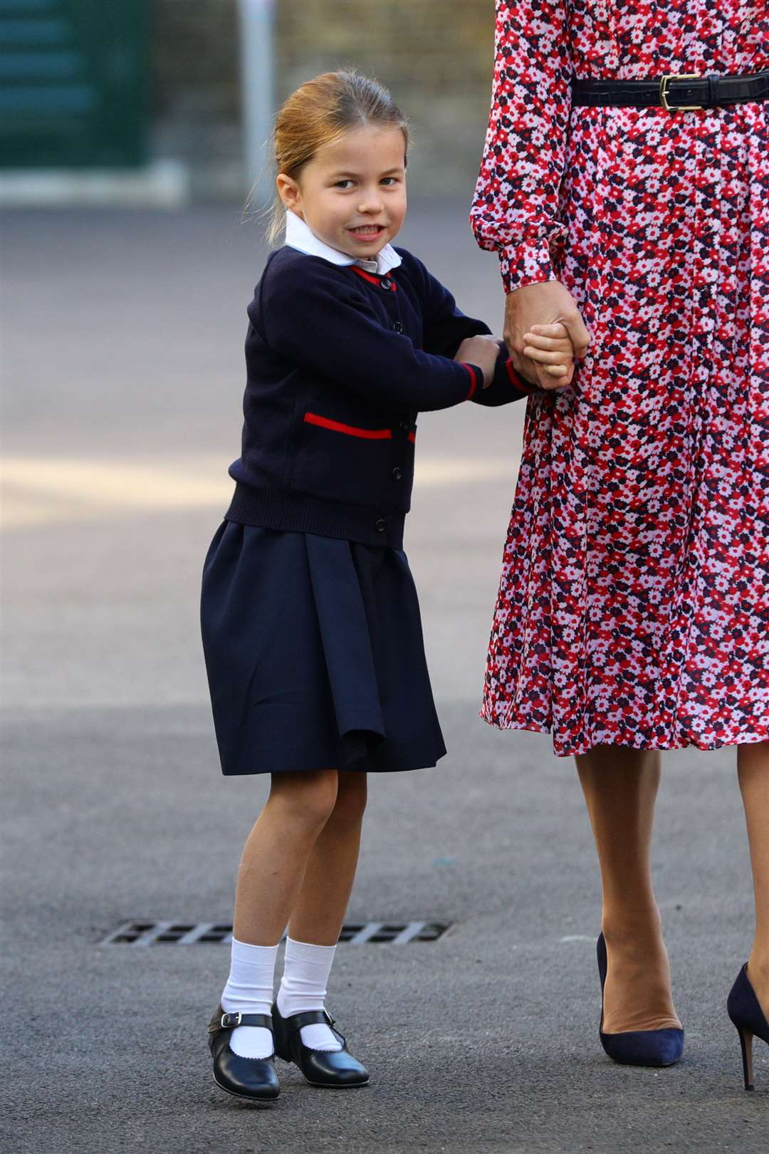 An excited Charlotte starts school (Aaron Chown/PA)